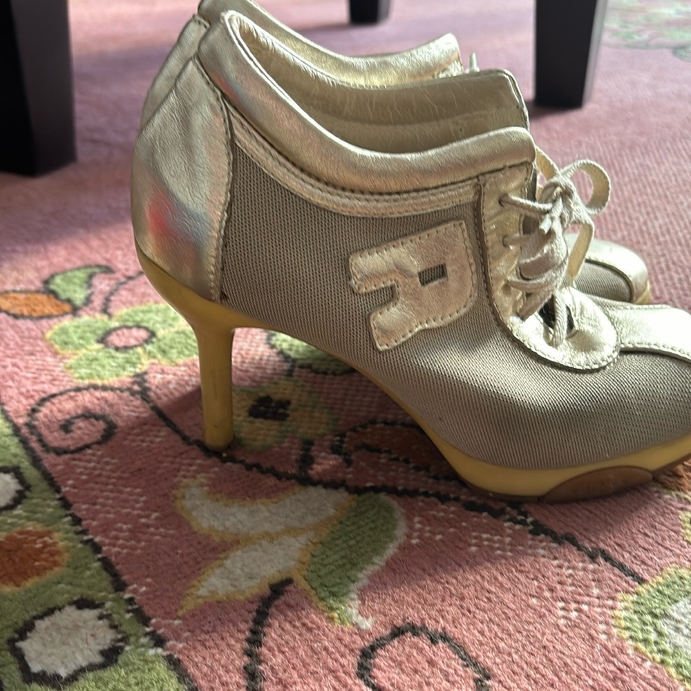 Bought in London Silver/mesh sneaker look heels e/lacing very good condition